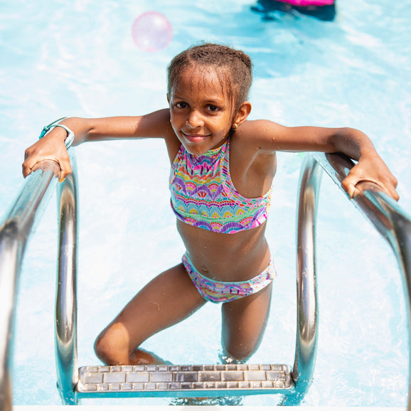 black kid girl swimming in pool